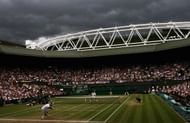A general view with dark rain clouds as Rafael Nadal of Spain plays a return during the men's singles Final match against Roger Federer of Switzerland on day thirteen of the Wimbledon Lawn Tennis Championships at the All England Lawn Tennis and Croquet Club on July 6, 2008 in London, England. (Photo by Julian Finney/Getty Images)